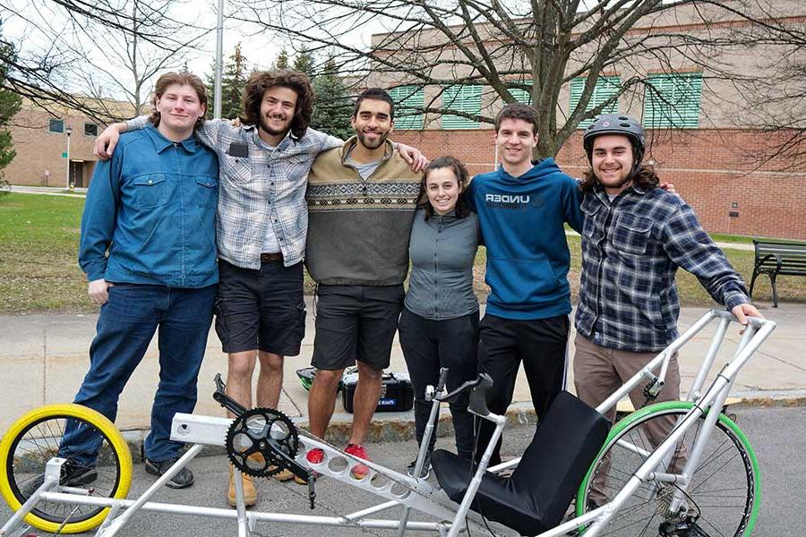 Students in front of the human powered vehicle