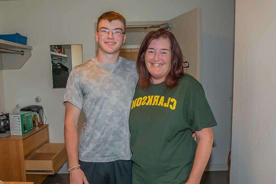 A mother and her son in his dorm after move in